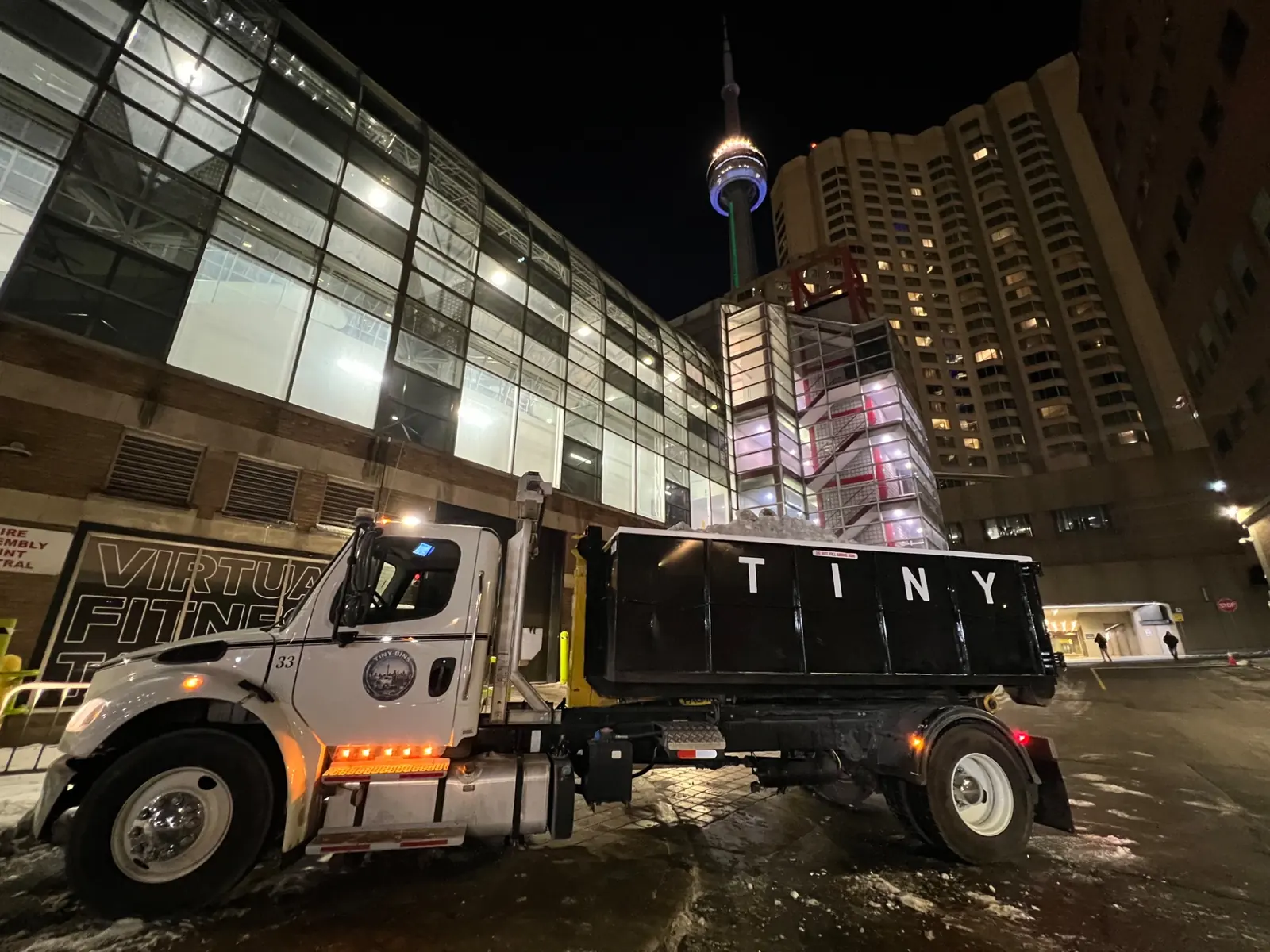 Tiny Bins truck at night in downtown Toronto